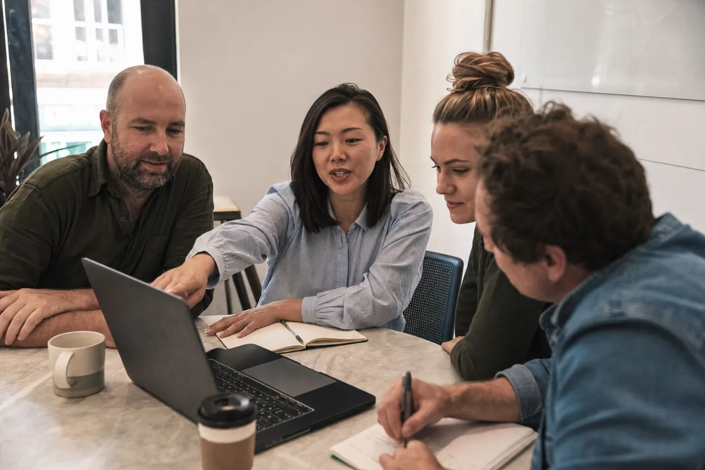 Coworkers engaged in lifelong learning at work during a hands-on training session